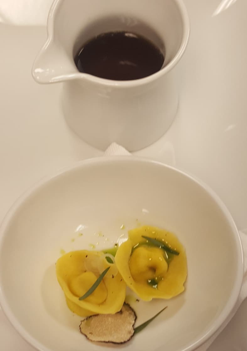 Egg tortellini | shaved truffle | tarragon | dark consommé